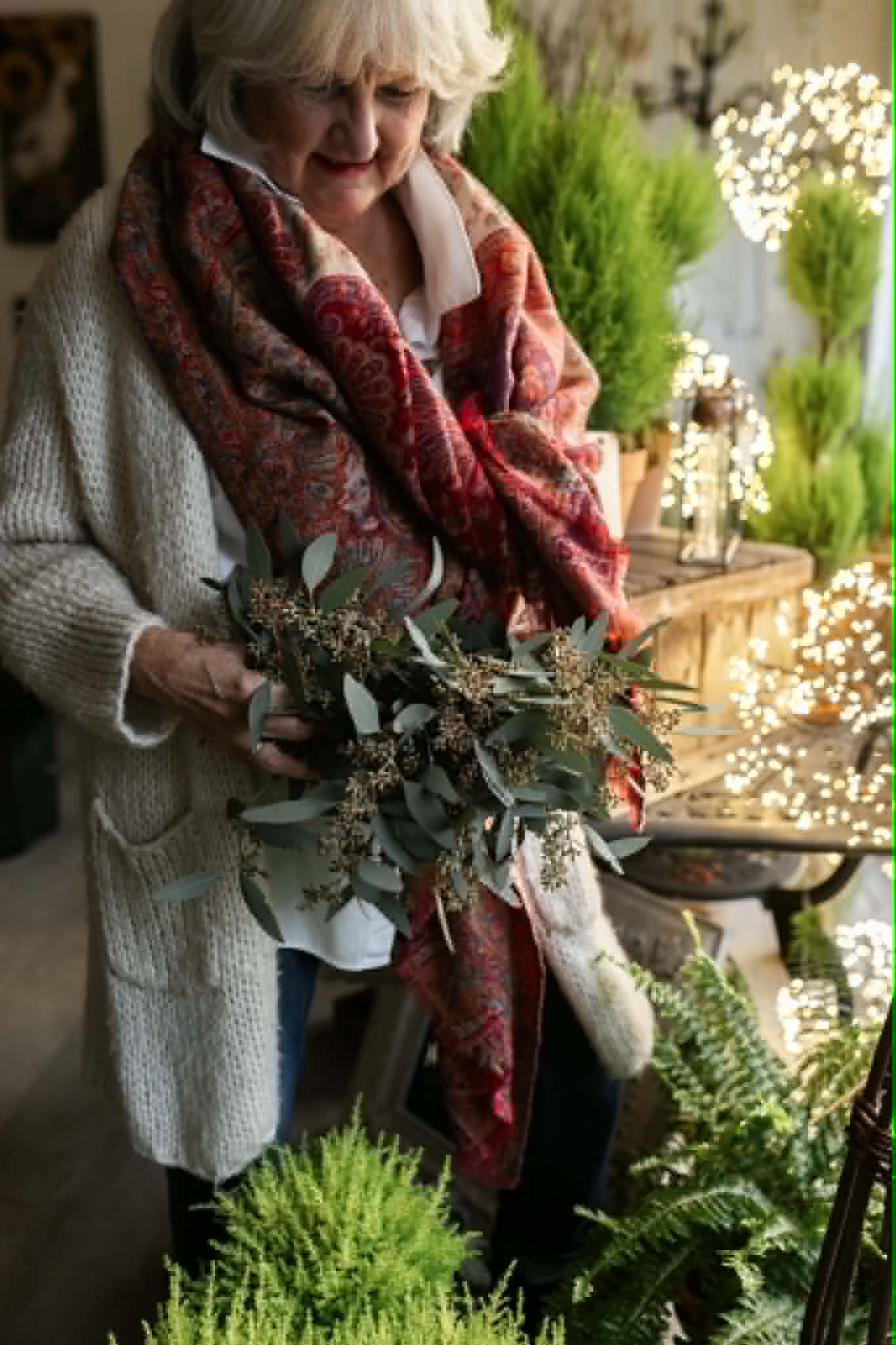Elaine holding wreath wreath